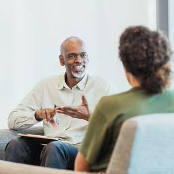 A Patelco advisor discusses auto insurance policies with a member.